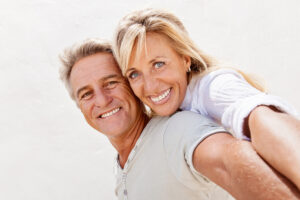 mature couple enjoying benefits of dental implants mature couple enjoying benefits of dental implants