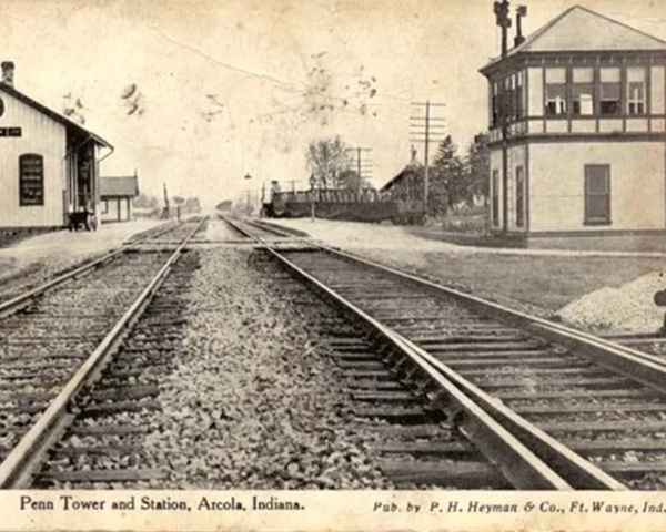 Historic railroad tracks and station building in Avoca, Indiana, early 1900s.